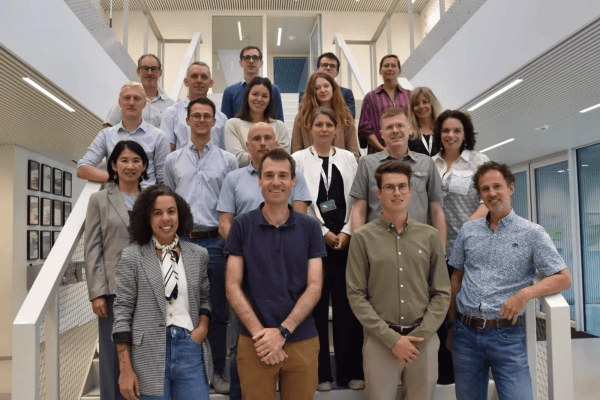 A group picture in front of the stairs at EnergyVille 1