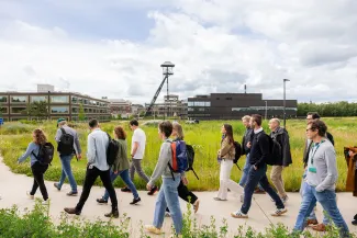 People walking in front of the EnergyVille buildings