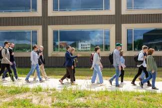 People walking in front of the EnergyVille building