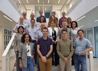 A group picture in front of the stairs at EnergyVille 1
