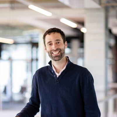 A man looking at the camera, smiling